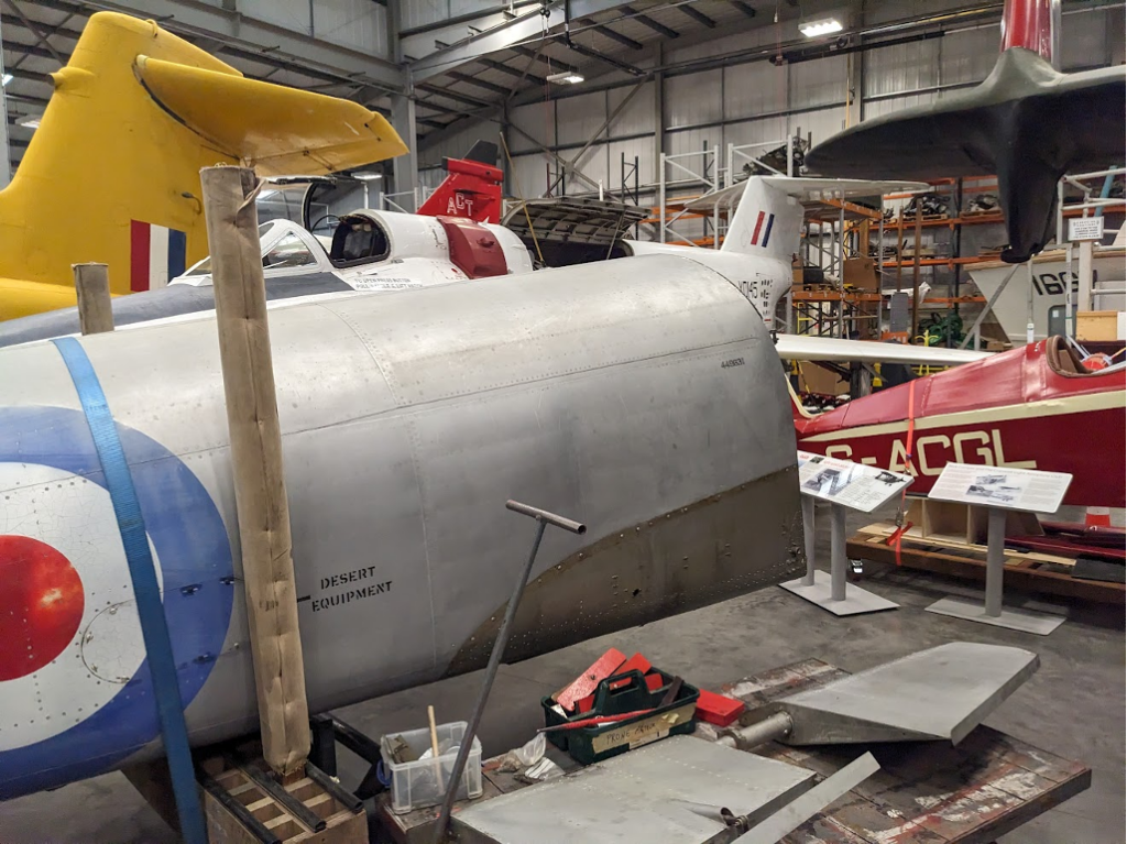 Figure 3: The team was battling with a very tight space to work in; the hangar was filled with all sorts of interesting aircraft types. How many can you spot in this image?